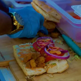 Putting a Shrimp Po&apos;boy together.