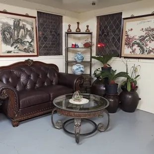 Resting area with plants and Chinese ink paintings.