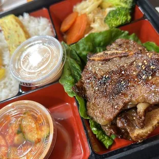 a bento box with a variety of food items