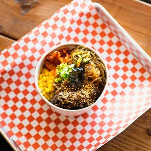 Bulgogi Cupbap, comes with white rice, corn, japchae,and our homemade kimchi.