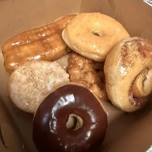 Here are some of the donuts I got   Maple bar  Apple crumb Glazed  Cinnamon Roll  Chocolate glaze