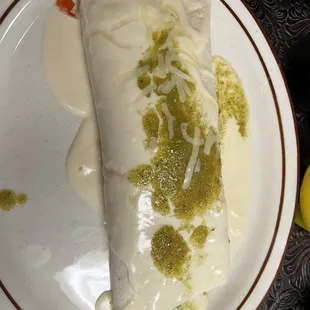 Burrito with special request green salsa on top.