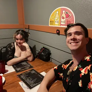 a man and a woman sitting at a table