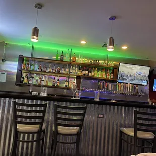 a woman sitting at the bar