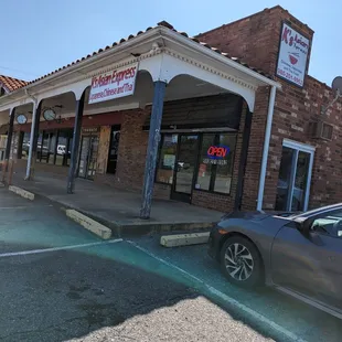 a car parked in front of the store