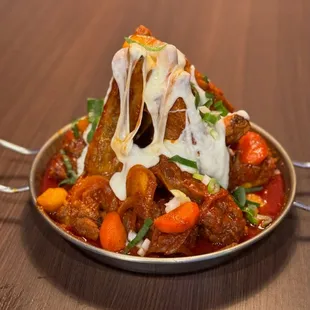 a plate of food with meat and vegetables