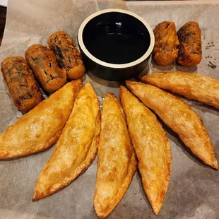 Seaweed and glass noodle rolls (1 eaten) and some fried dumplings.