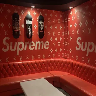 a red couch and a white table