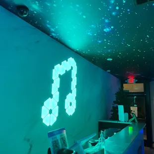 a neon sign on a wall