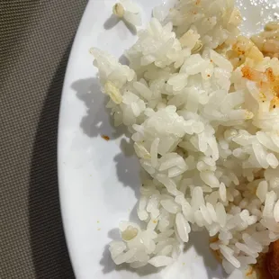 a plate of rice, meat and vegetables