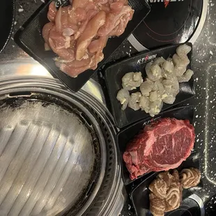 Chicken. Garlic shrimp, ribeyes, bacon !