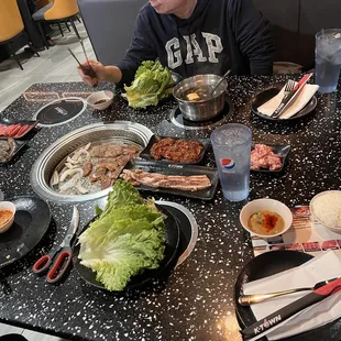 Spicy beef bulgogi, short rib, tom yum broth, mushroom broth, and other banchan