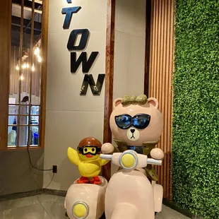 a teddy bear on a scooter