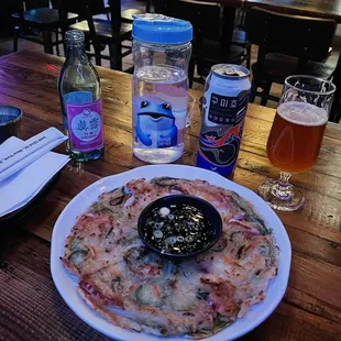 Seafood pancake! So delicious! Perfectly crispy, just the right thickness, and so generous with the seafood. My favorite spot in K-town!