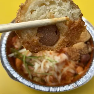 Korean Corn Dog dipped in Cheesy Tteokbokki