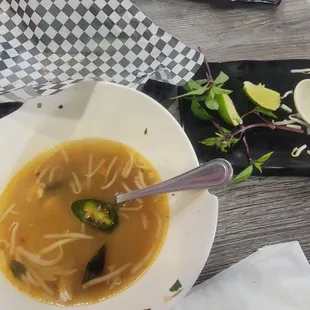 Empty Chicken Pho and Banh mi sandwich plate