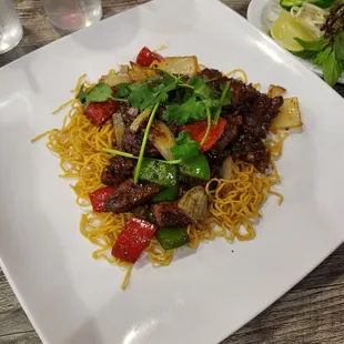 saute diced fillet mignon w/pan fried garlic egg noodle