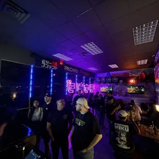 a group of people in a bar