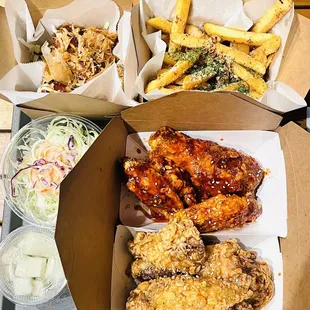 a tray of fried chicken and french fries