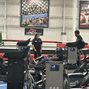 Staff member (Tiffany) assisting my  autistic son get ready for race.