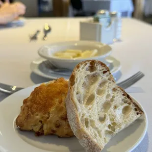 a piece of bread and butter on a plate
