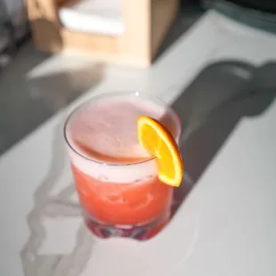 a drink with a slice of orange