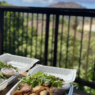 two trays of food on a table