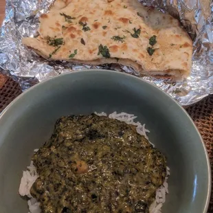 The delicious vegetarian saag cholay with fresh garlic naan