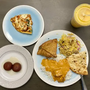 Chicken tikka masala pizza, vegetable samosa, chicken biryani, chicken butter, garlic naan, gulab jaman, and mango lassi