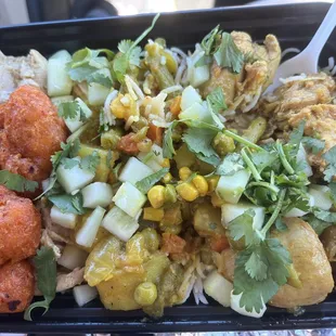 Chicken rice &amp; plain rice with curry chicken &amp; butter chicken. Mixed veggies &amp; breaded cauliflower bites. Topped with cilantro &amp; cucumber.