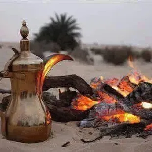 a tea pot and fire in the desert