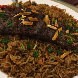 a plate of rice and meat