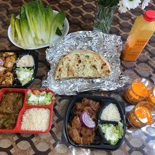Garlic naan, lamb bhuna, bihari chicken, malai chicken, mango lassi