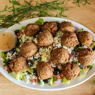 a plate of salad with dressing