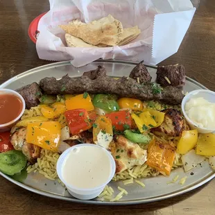 Beef, chicken, kafta kabobs with rice, veg, pita. Good.