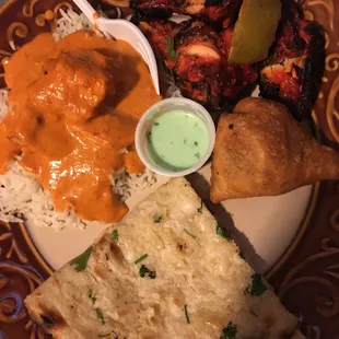 Chicken tikka masala, tandoori wings, veg samosa and garlic naan. All delicious