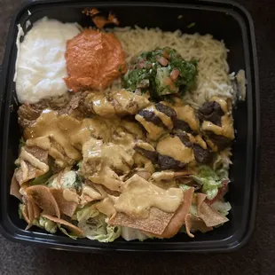 Brown rice with spicy chicken, beef lula, and shrimp