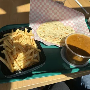 French Fries w Curry Sauce (Medium heat) $7.95 w Garlic Naan - 2 pieces $3.99
