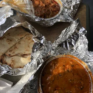 Butter chicken (bottom), spicy chicken with peppers (forgot the name, and naan