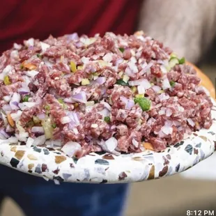 a man holding a plate of food