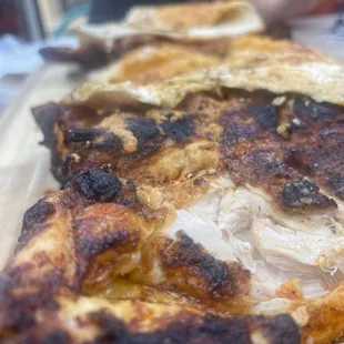 a close up of a piece of pizza