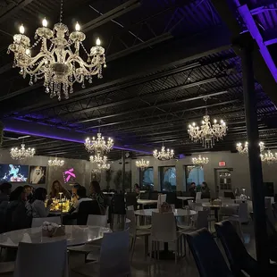 Interior around 730pm on a Thursday - got packed right before 9p! Lots of tables and tvs, gorgeous chandeliers