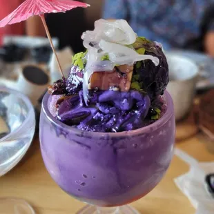 a purple dessert in a glass