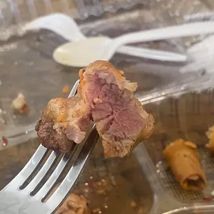 Another piece of the undercooked chicken