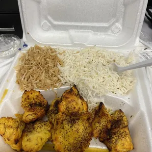 a takeout container with rice and chicken
