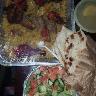 Combo for Two: Shami Kabob, Bihari Kabob, Seekh Kabob, Chicken Tandoori over rice with Salad, Soup, and Naan.