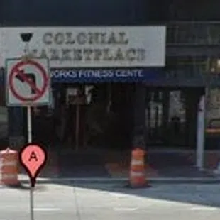 a no parking sign on a street corner