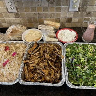 Four shawarma dinners, extra garlic and hummus. My pans.