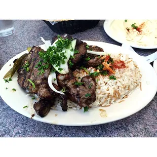 Lamb chops dinner with rice and almond slivers