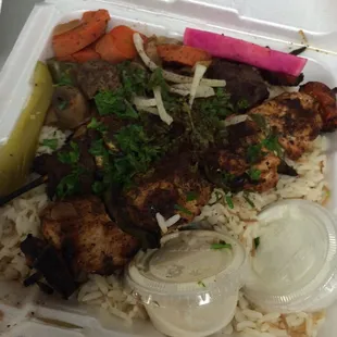 Kabob combo. 1 beef and 1 chicken. Sautéed vegetables and pickles.
